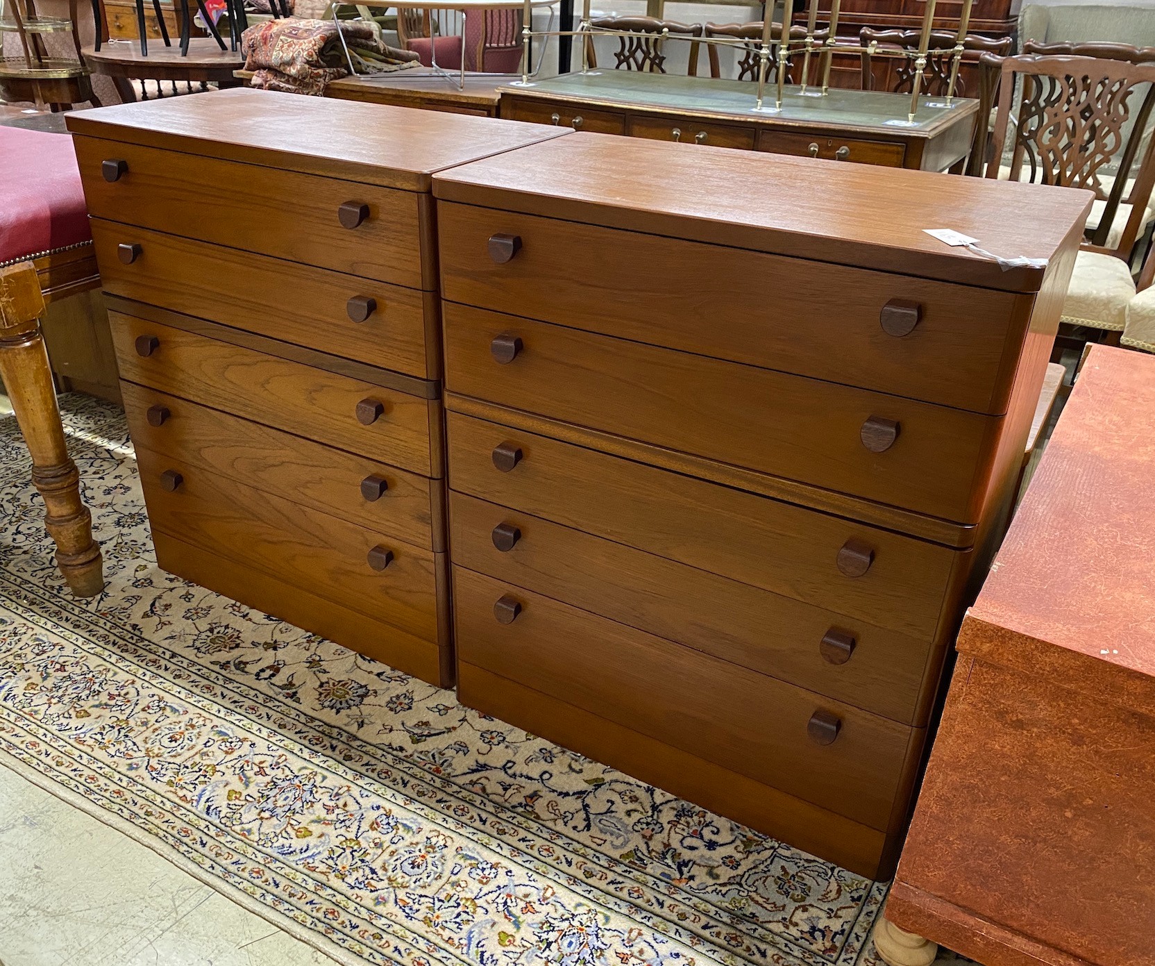 A pair of mid century Stag teak five drawer bedside chests, width 82cm, depth 44cm, height 96cm